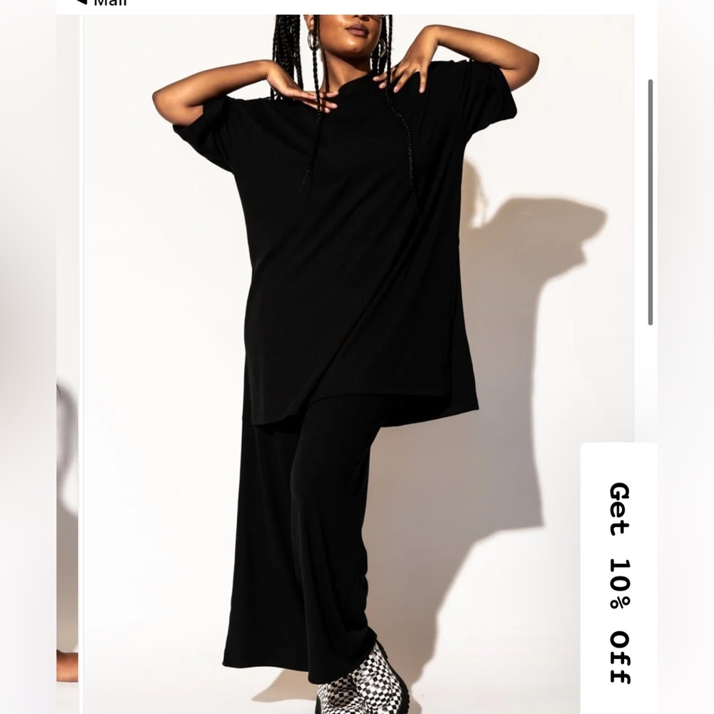 Dressed in LALA Leveled up ribbed playsuit in black